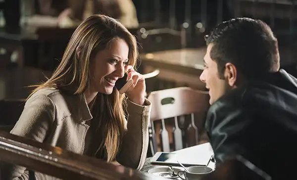 Couple laughing at table